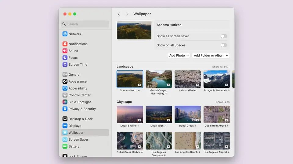 Mục Hình nền trong Cài đặt hệ thống macOS với các ảnh nền Phong cảnh và Đô thị